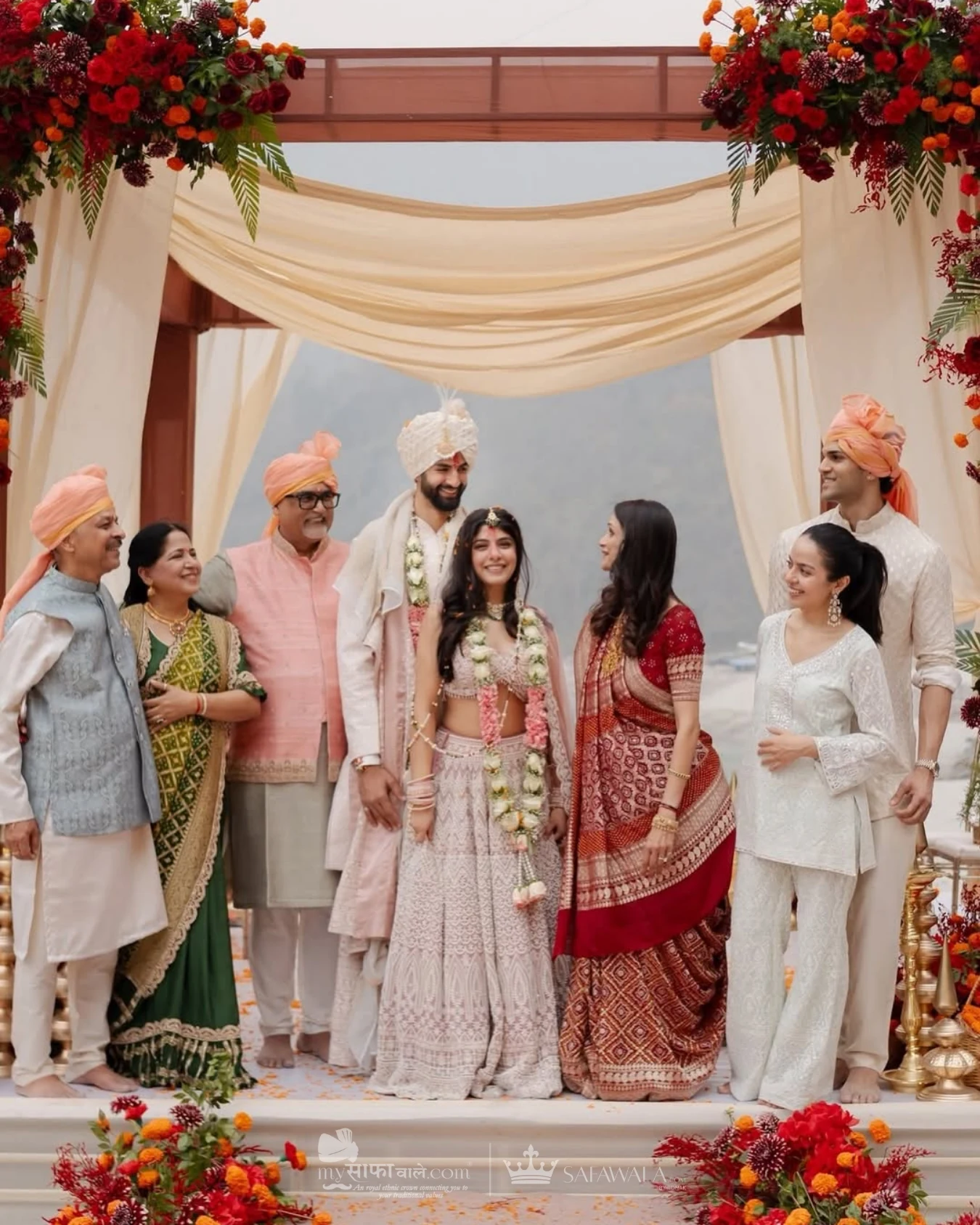 Royal red wedding safa and embroidered groom styling for Vake